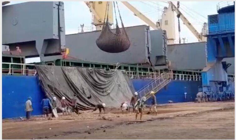 Port crane lifting export containers